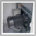 Motor with frequency drive system, housed inside a purpose built sound-proof enclosure, with a small fan for ventilation.
